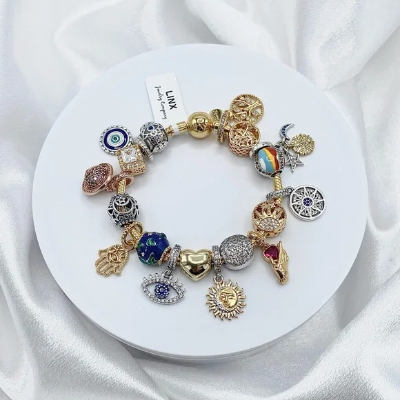 Linx Gold Snake Chain Bracelet with Universe Hamsa and Evil Eye Themed Charms
